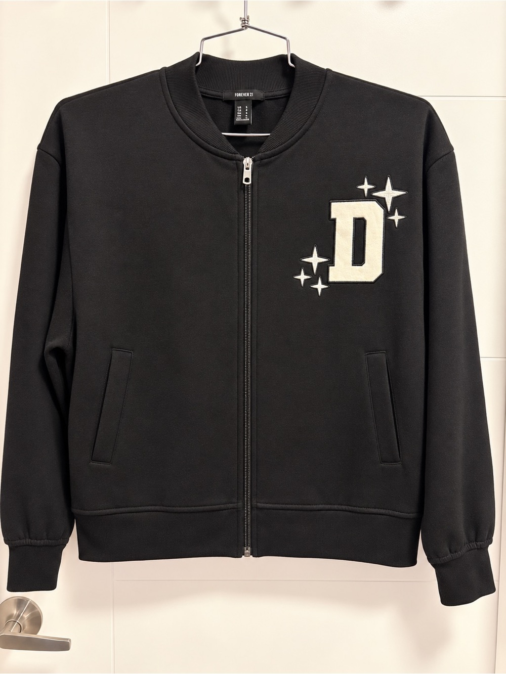 Unisex Black Zip-Up Jacket with 'D' Patch
Never worn